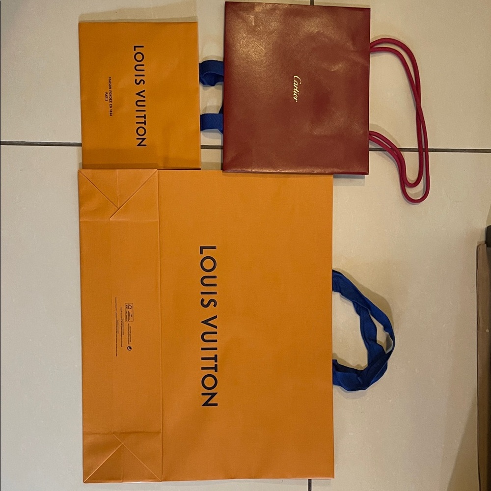 2 Louis Vuitton bags and 2 Cartier Shopping Bags